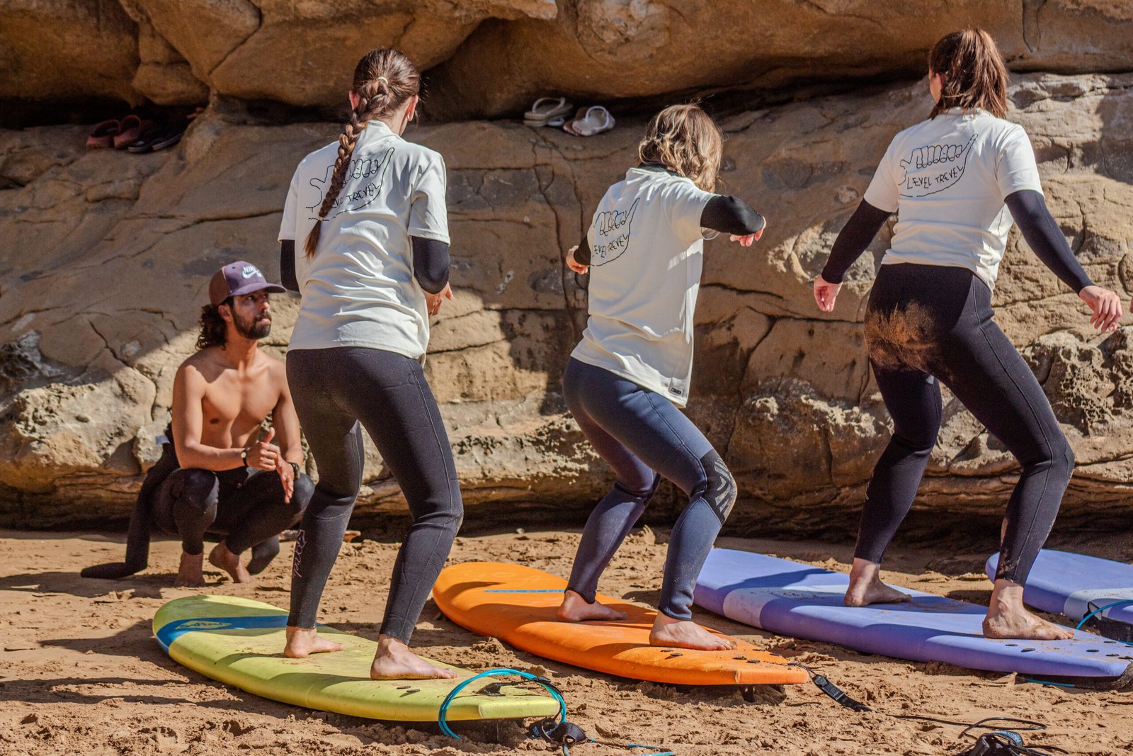 Small group practising surf stance with an instructor in Imsouane